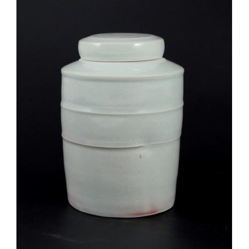 90 - § § Edmund de Waal (b.1964) a banded cylinder porcelain lidded jar, c.1993, covered in a pale celado... 