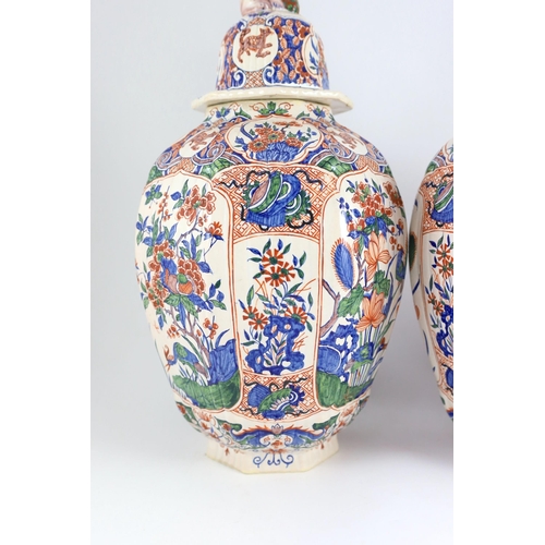 93 - A pair of large Delft jars and covers, Pieter Kocx factory De Grieksche A, c.1701-1722, each of lobe... 