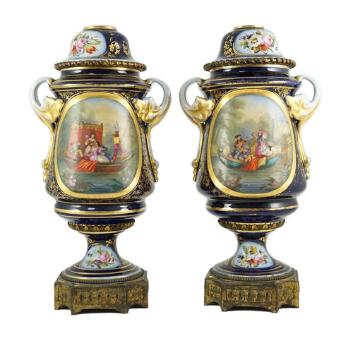 99 - A pair of Sevres style Paris porcelain and ormolu mounted oil lamps, late 19th century, each painted... 