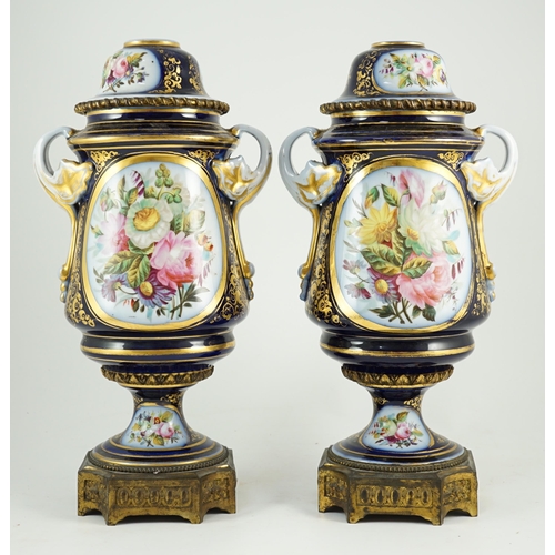 99 - A pair of Sevres style Paris porcelain and ormolu mounted oil lamps, late 19th century, each painted... 