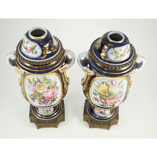 99 - A pair of Sevres style Paris porcelain and ormolu mounted oil lamps, late 19th century, each painted... 