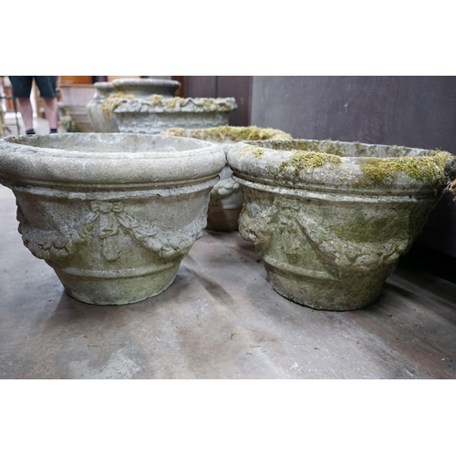 1016 - A set of three circular reconstituted stone garden planters with swagged bodies, diameter 48cm, heig... 