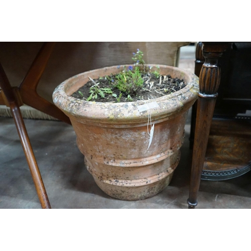 1038 - A circular terracotta garden planter, diameter 56cm, height 44cm