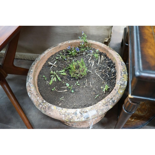 1038 - A circular terracotta garden planter, diameter 56cm, height 44cm