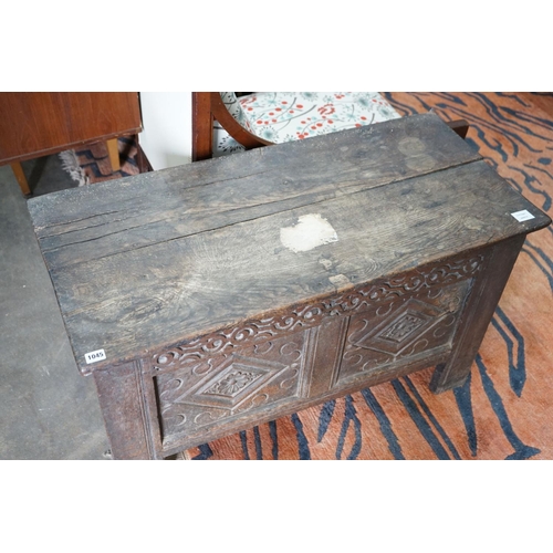 1045 - A small 18th century carved oak coffer, with a carved panelled front, length 102cm, depth 47cm, heig... 