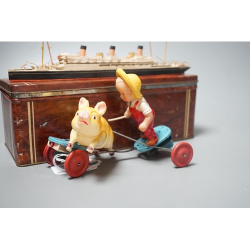 1490 - Bassett-Lowke Waterline Model Ships and a Japanned boxed celluloid pig chaser toy, 9cms high.... 