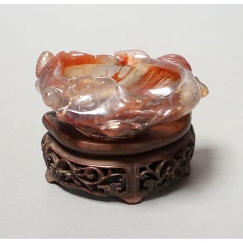 1491 - A late 19th / early 20th century Chinese agate brushwasher, wood stand - 8cm tall