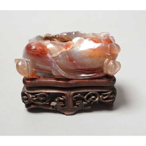 1491 - A late 19th / early 20th century Chinese agate brushwasher, wood stand - 8cm tall