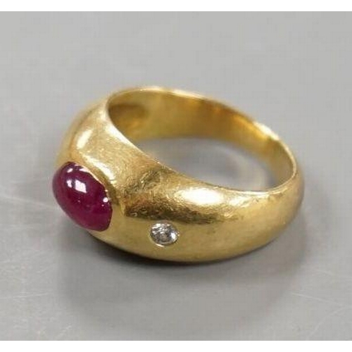 1923 - A yellow metal, cabochon ruby and two stone diamond chip set ring, size E/F, gross weight 6.6 grams.... 