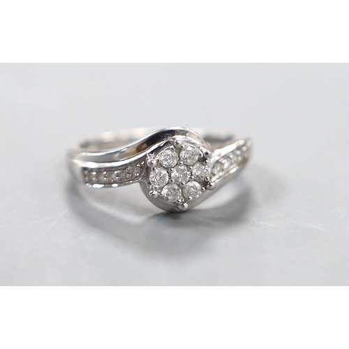 1924 - A modern 18kt white metal and diamond cluster set  ring, size P, gross weight 3.8 grams.