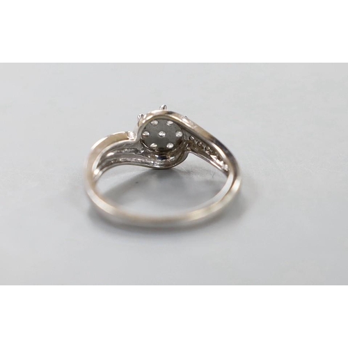 1924 - A modern 18kt white metal and diamond cluster set  ring, size P, gross weight 3.8 grams.