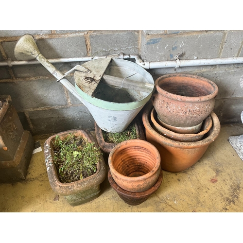 14 - A pair of rectangular terracotta garden planters, width 40cm, a vintage watering can and six circula... 