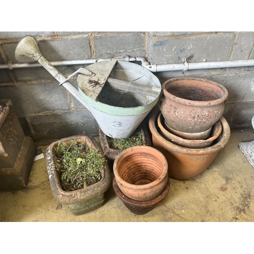 14 - A pair of rectangular terracotta garden planters, width 40cm, a vintage watering can and six circula... 