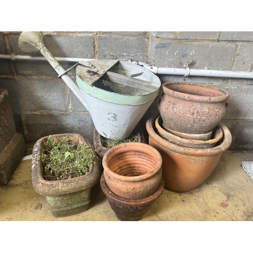 14 - A pair of rectangular terracotta garden planters, width 40cm, a vintage watering can and six circula... 