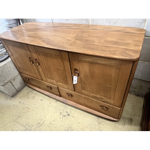 17 - An Ercol honeydew elm sideboard, width 129cm depth 49cm height 6cm
