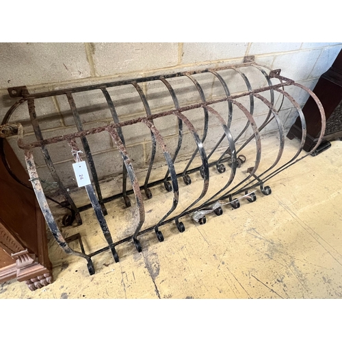 24 - A pair of wrought iron bowfront balcony rails, widest 140cm height 71cm