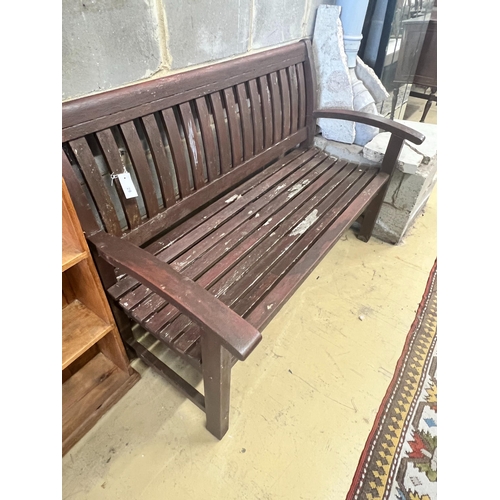 29 - A stained teak slatted garden bench, 138 x 58cm height 92cm