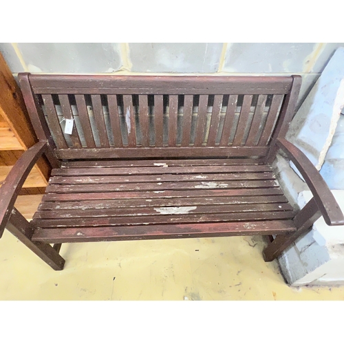 29 - A stained teak slatted garden bench, 138 x 58cm height 92cm