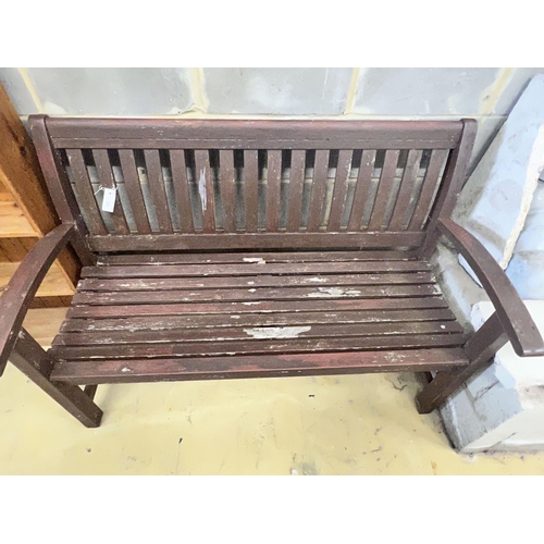 29 - A stained teak slatted garden bench, 138 x 58cm height 92cm
