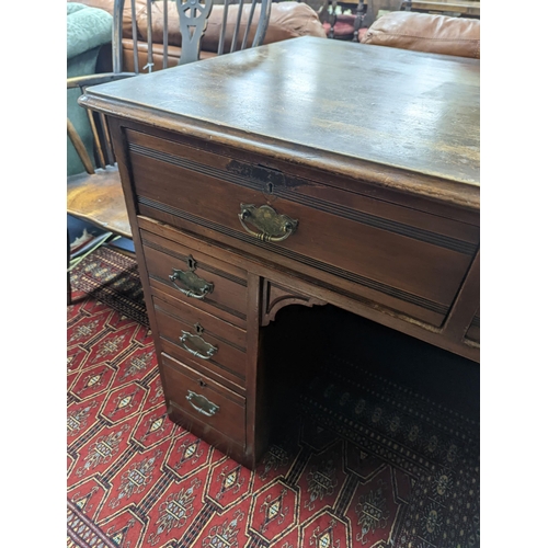 47 - A late Victorian mahogany kneehole desk, length 107cm, height 80cm
