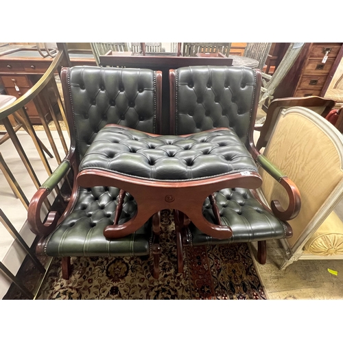 54 - A pair of Victorian style mahogany and buttoned green leather open armchairs and matching footstool... 