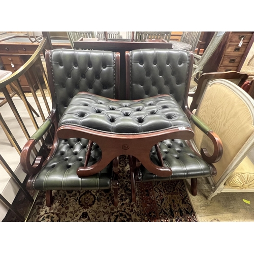 54 - A pair of Victorian style mahogany and buttoned green leather open armchairs and matching footstool... 