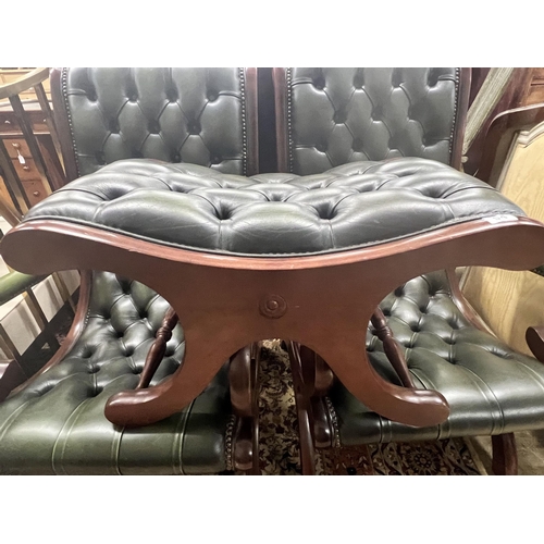 54 - A pair of Victorian style mahogany and buttoned green leather open armchairs and matching footstool... 