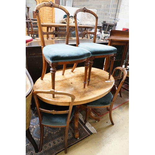 58 - A Victorian burr walnut oval topped dining table, width 120cm, depth 85cm, height 70cm together with... 