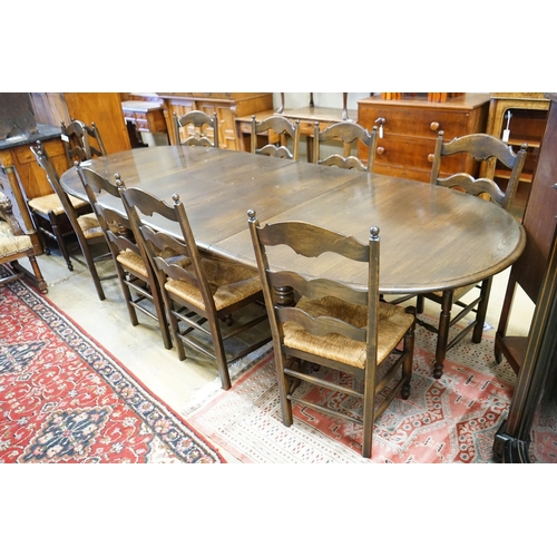 60 - A French style oak extending dining table, with two spares leaves, 280cm extended, width 11cm, heigh... 