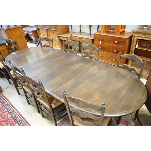 60 - A French style oak extending dining table, with two spares leaves, 280cm extended, width 11cm, heigh... 