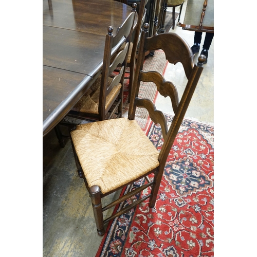 60 - A French style oak extending dining table, with two spares leaves, 280cm extended, width 11cm, heigh... 