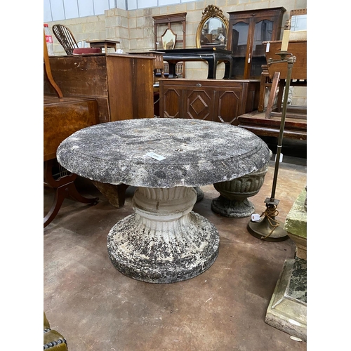 1045 - A circular reconstituted stone garden table, diameter 90cm, height 62cm