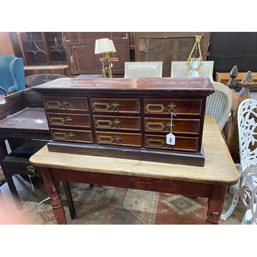 1055 - A Victorian style nine drawer table top filing chest, width 79cm, depth 24cm, height 35cm