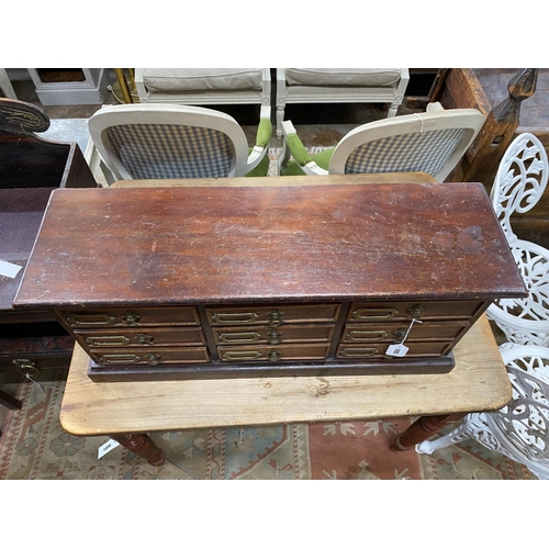 1055 - A Victorian style nine drawer table top filing chest, width 79cm, depth 24cm, height 35cm