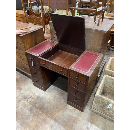 1062 - A George III style mahogany kneehole desk with hinged central section, width 104cm, depth 55cm, heig... 