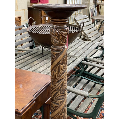 1078 - A Victorian style carved mahogany torchere, (formerly a bedpost)