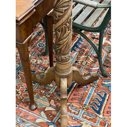 1078 - A Victorian style carved mahogany torchere, (formerly a bedpost)