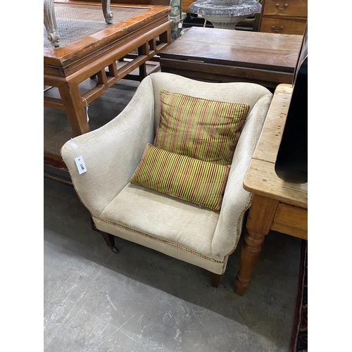 1108 - An Edwardian upholstered armchair together with a 19th century style painted footstool