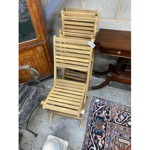 1120 - A set of four slatted wood folding garden chairs