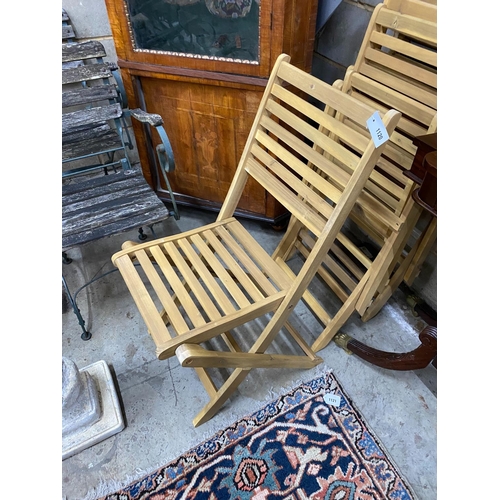 1120 - A set of four slatted wood folding garden chairs