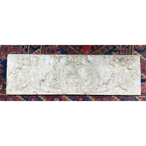 1136 - A rectangular reconstituted stone garden plaque with lions, width 76cm