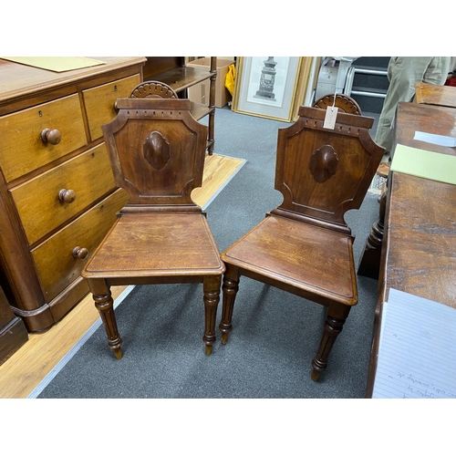 1178 - A pair of Victorian mahogany hall chairs