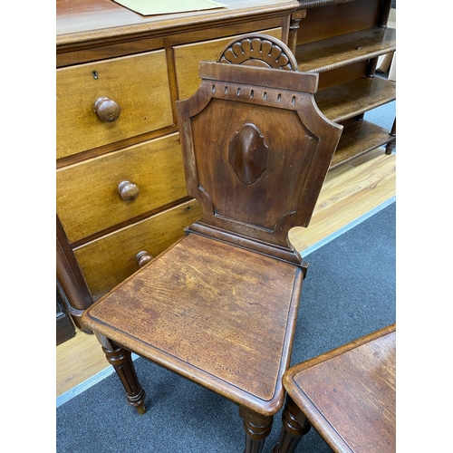 1178 - A pair of Victorian mahogany hall chairs