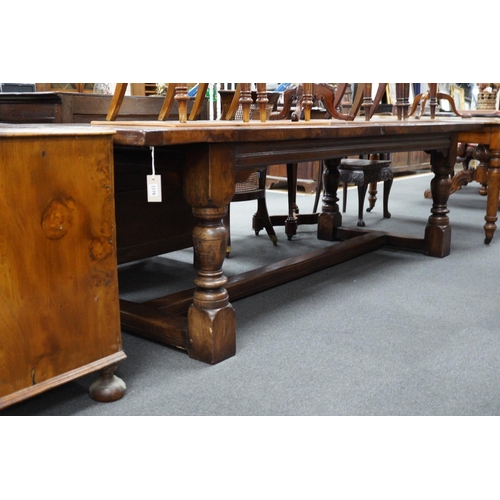 1179 - An 18th century style plank top rectangular oak refectory table, length 259cm, width 90cm, height 75... 