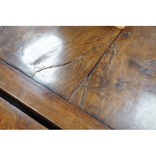 1179 - An 18th century style plank top rectangular oak refectory table, length 259cm, width 90cm, height 75... 