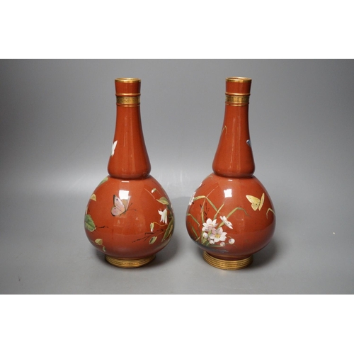 1254 - A pair of Mintons Aesthetic period enamelled pottery vases, c.1879, 26cm