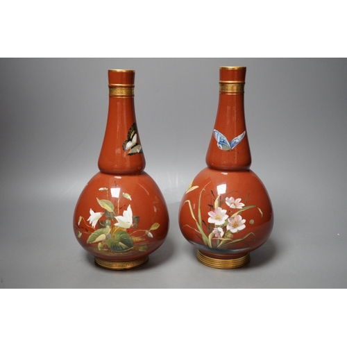 1254 - A pair of Mintons Aesthetic period enamelled pottery vases, c.1879, 26cm