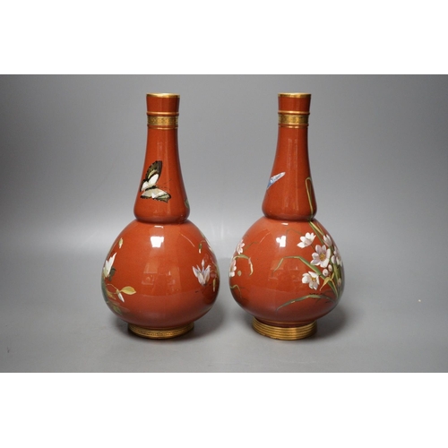 1254 - A pair of Mintons Aesthetic period enamelled pottery vases, c.1879, 26cm