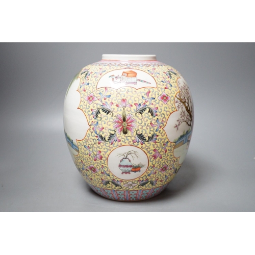 1256 - A Chinese yellow ground famille rose jar, Republic Period, 22cm