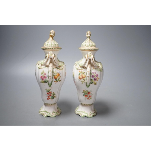 1258 - A pair of Copelands London, fruit decorated two handled vases and covers, circa 1900- 20cms high.... 